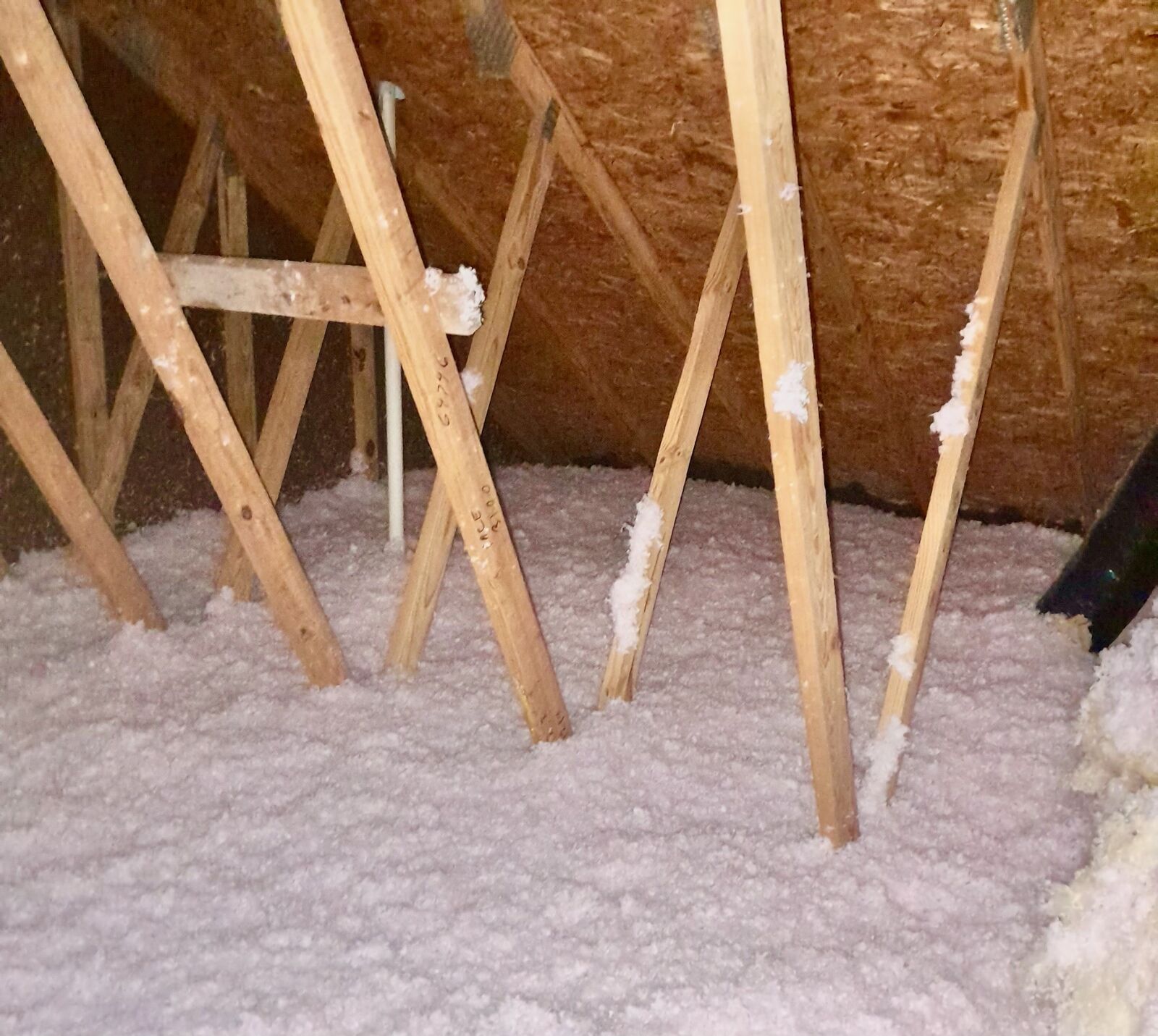 After: Real blown-in fiberglass insulation installed by Universal Insulation Doctor in Norfolk VA attic